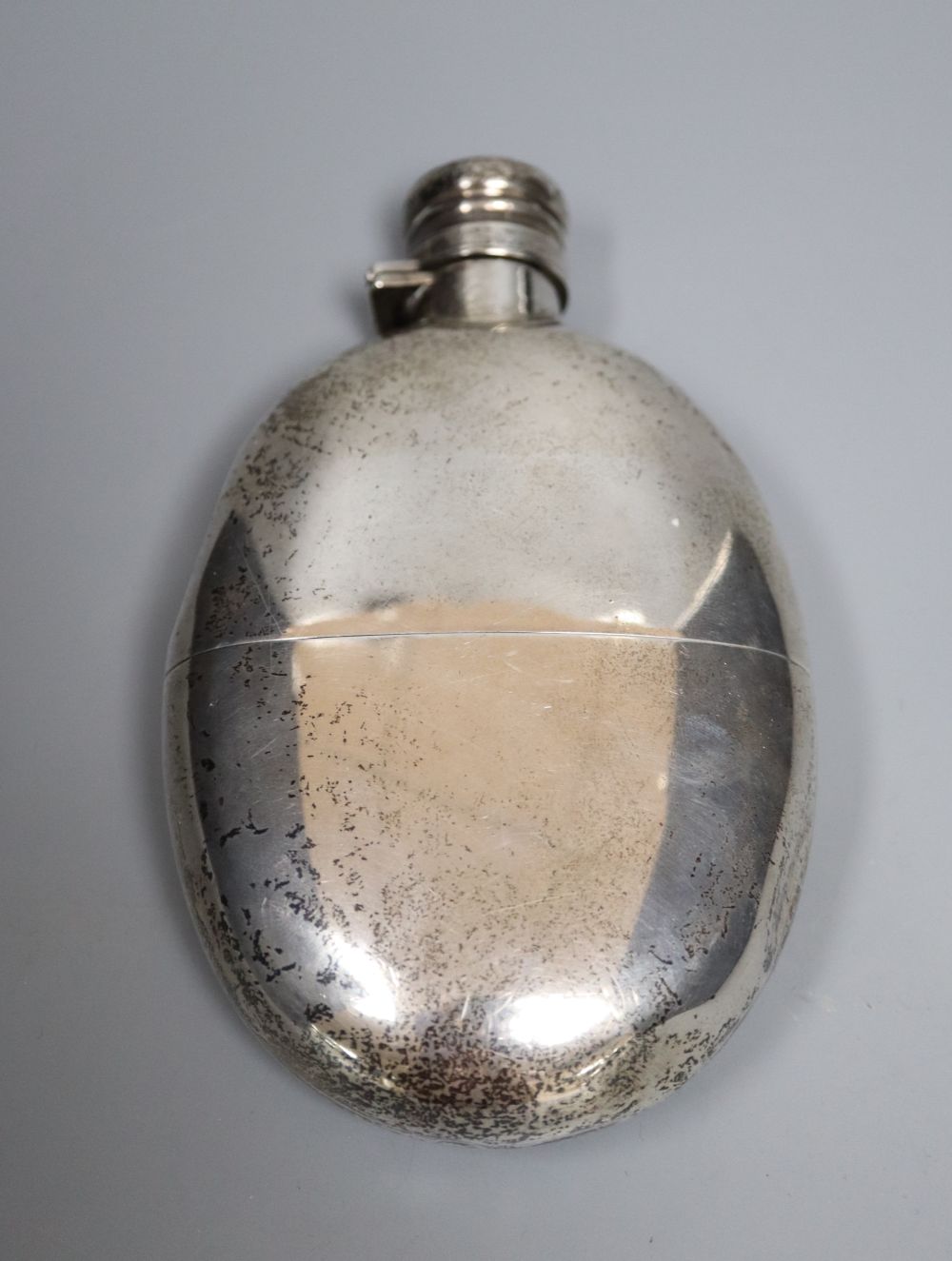 A late Victorian silver oval hip flask, Sampson Mordan & Co, London, 1895, 14.2cm, gross 7oz.
