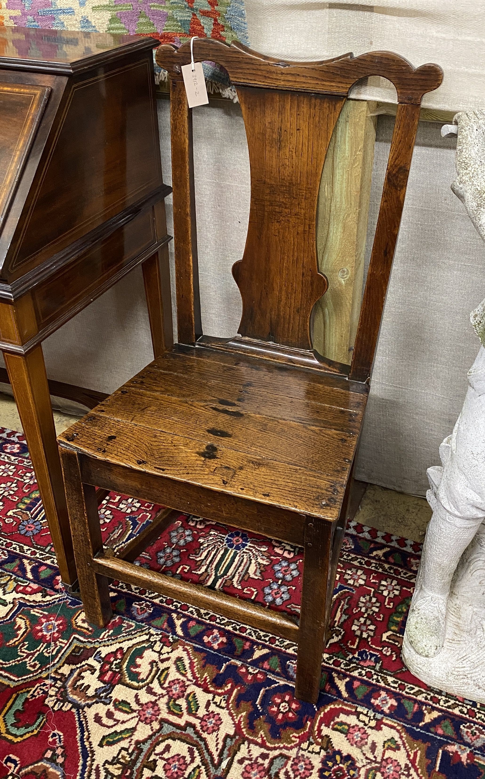 An 18th century oak wood seat chair