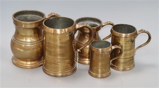 Five 19th century bell metal mugs height 17cm Five 19th century bell metal mugs height 17cm