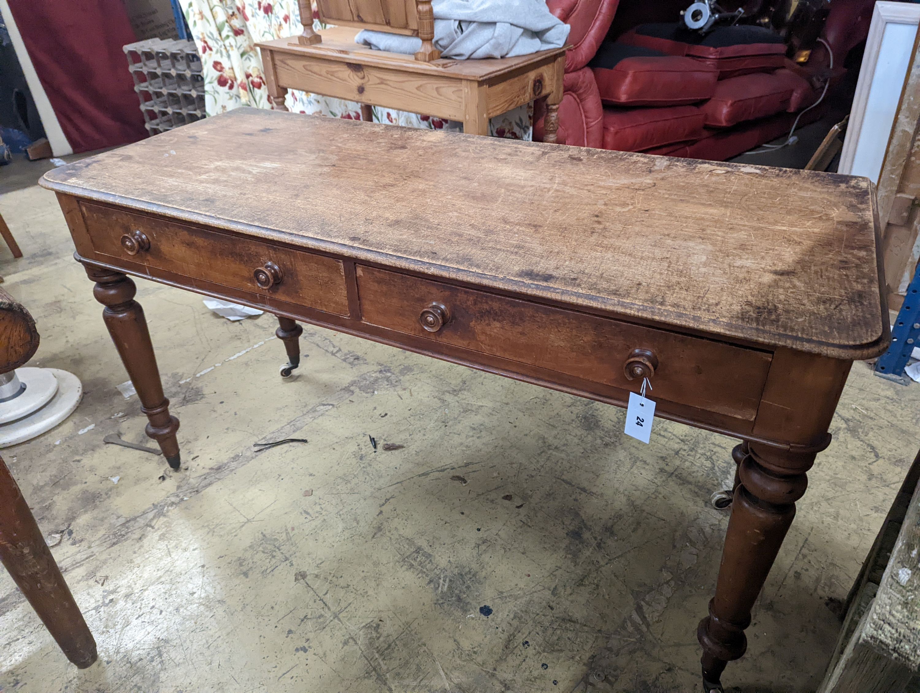 A Victorian mahogany two drawer writing table, length 136cm, depth 57cm, height 76cm