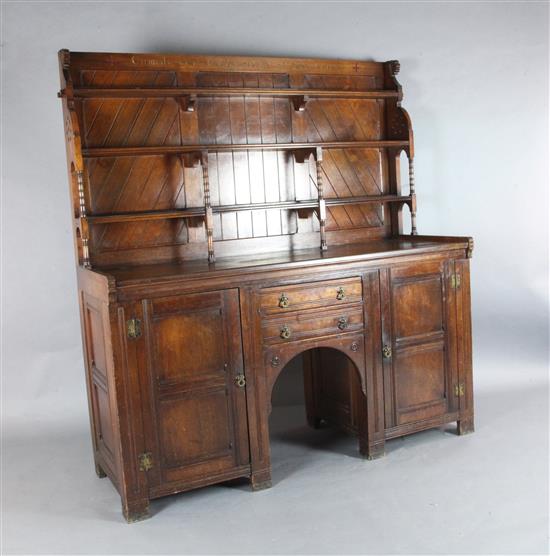A Victorian Gothic revival red walnut sideboard, in the manner of Charles Locke Eastlake, W.5ft 7.25in. A Victorian Gothic revival red walnut sideboard, in the manner of Charles Locke Eastlake, W.5ft 7.25in.