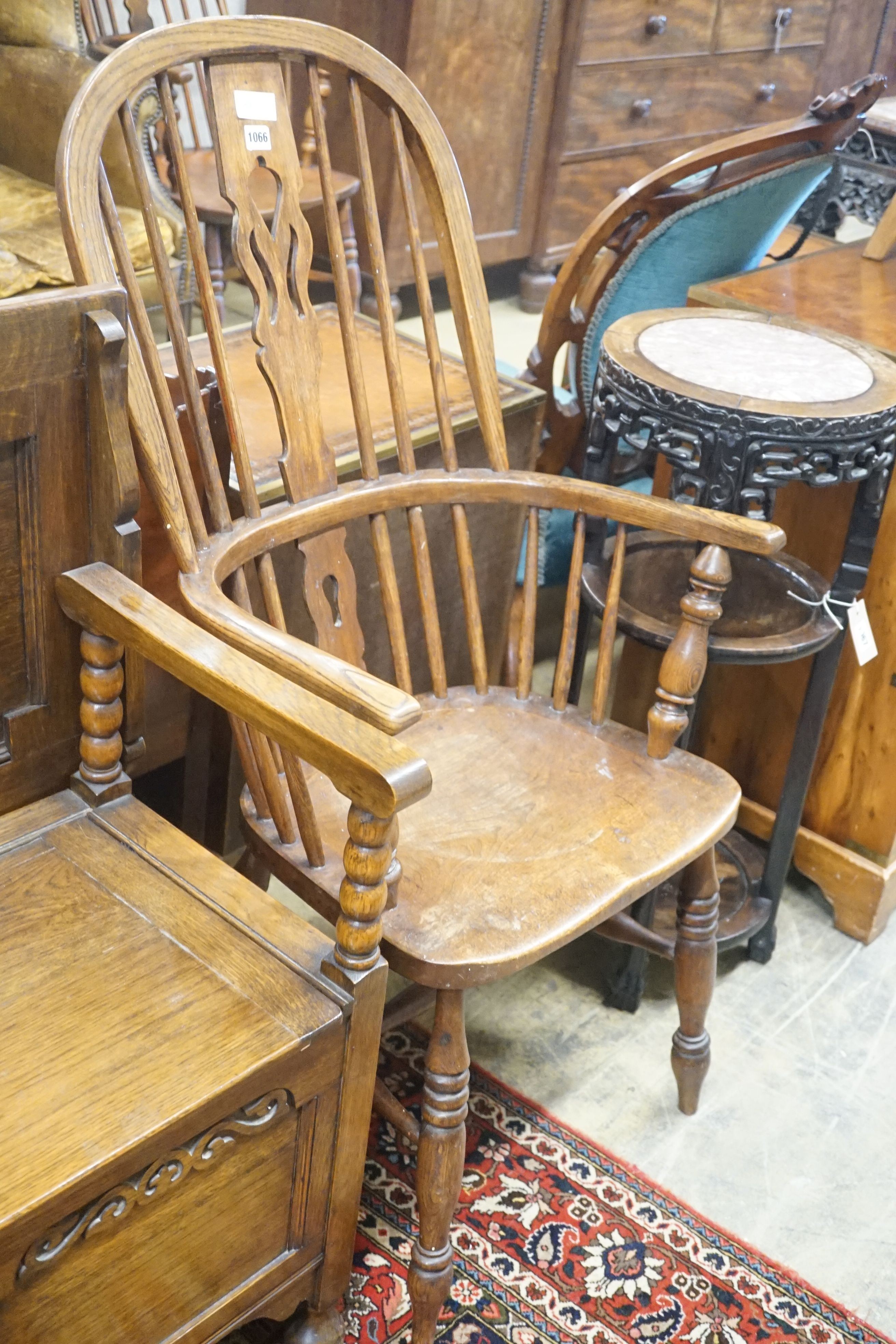 A 19th century Windsor elm and beech armchair, width 58cm depth 46cm height 114cm
