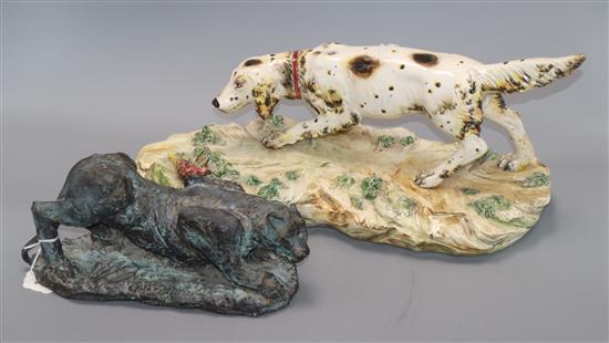 A Continental ceramic figure of a hound, on naturalistic plinth base and a stoneware model of a big cat A Continental ceramic figure of a hound, on naturalistic plinth base and a stoneware model of a big cat