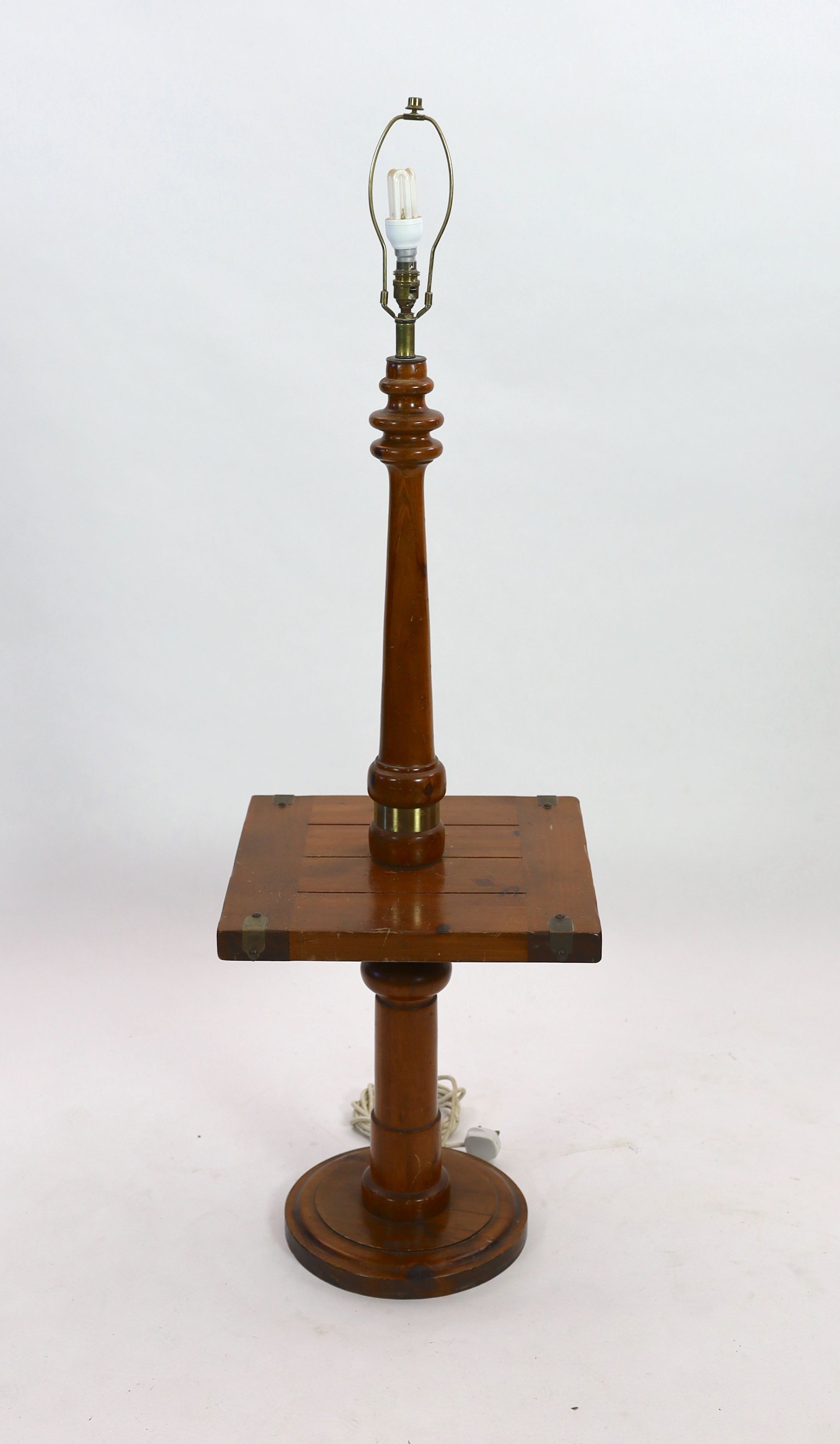 A pine and walnut standard lamp, with square mid tier, height 118cm