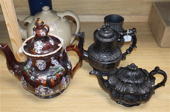 A bargeware treacle-glazed teapot (finial a.f.), a heavy stoneware teapot and three other items, A bargeware treacle-glazed teapot (finial a.f.), a heavy stoneware teapot and three other items,