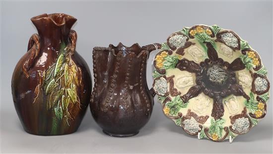 An Edward Bingham Hedingham Castle majolica masks wall plate and two other items, An Edward Bingham Hedingham Castle majolica masks wall plate and two other items,