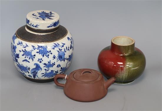 A Chinese squat baluster vase, crackle-glazed in green and red, a blue and white ginger jar and cover and a redware teapot A Chinese squat baluster vase, crackle-glazed in green and red, a blue and white ginger jar and cover and a redware teapot