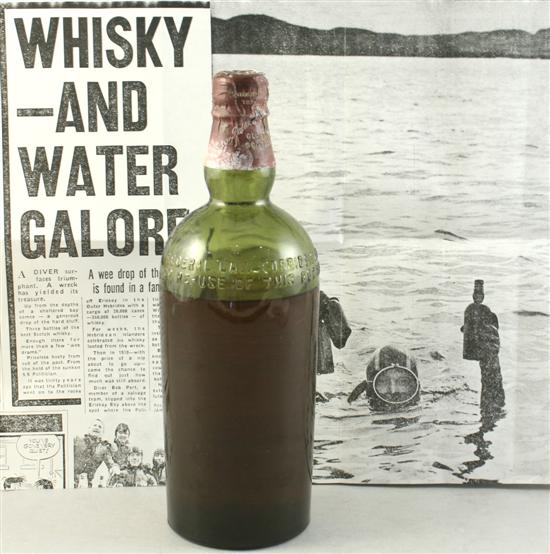 WHISKY GALORE: A bottle of Ballantines whisky yielded from the hold of the sunken ship, SS Politician, WHISKY GALORE: A bottle of Ballantines whisky yielded from the hold of the sunken ship, SS Politician,