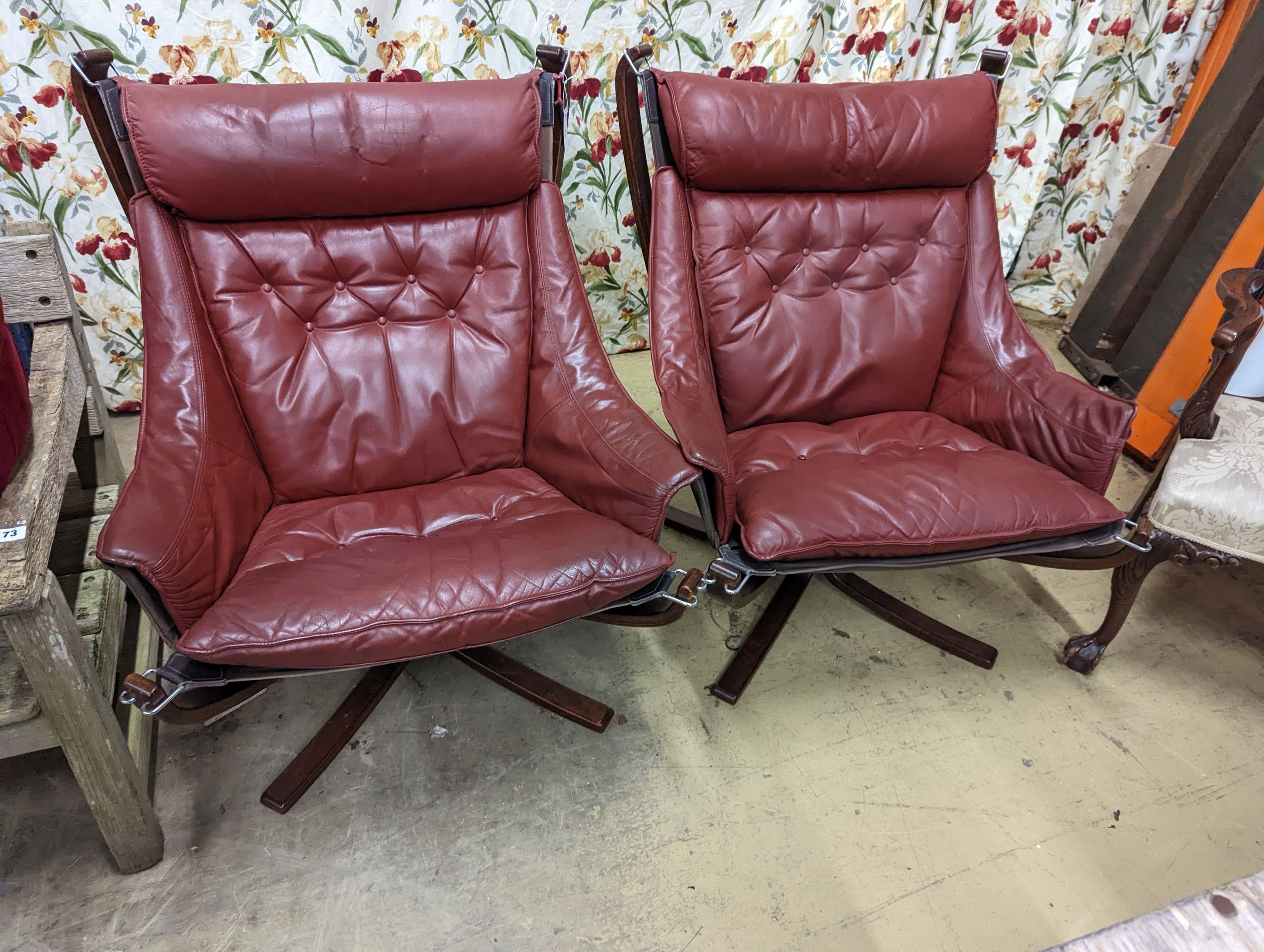 Sigurd Resell for Vatne Mobler, a pair of Burgundy leather 'Falcon' chairs, with stained bentwood frames, width 82cm, depth 76cm, height 99cm