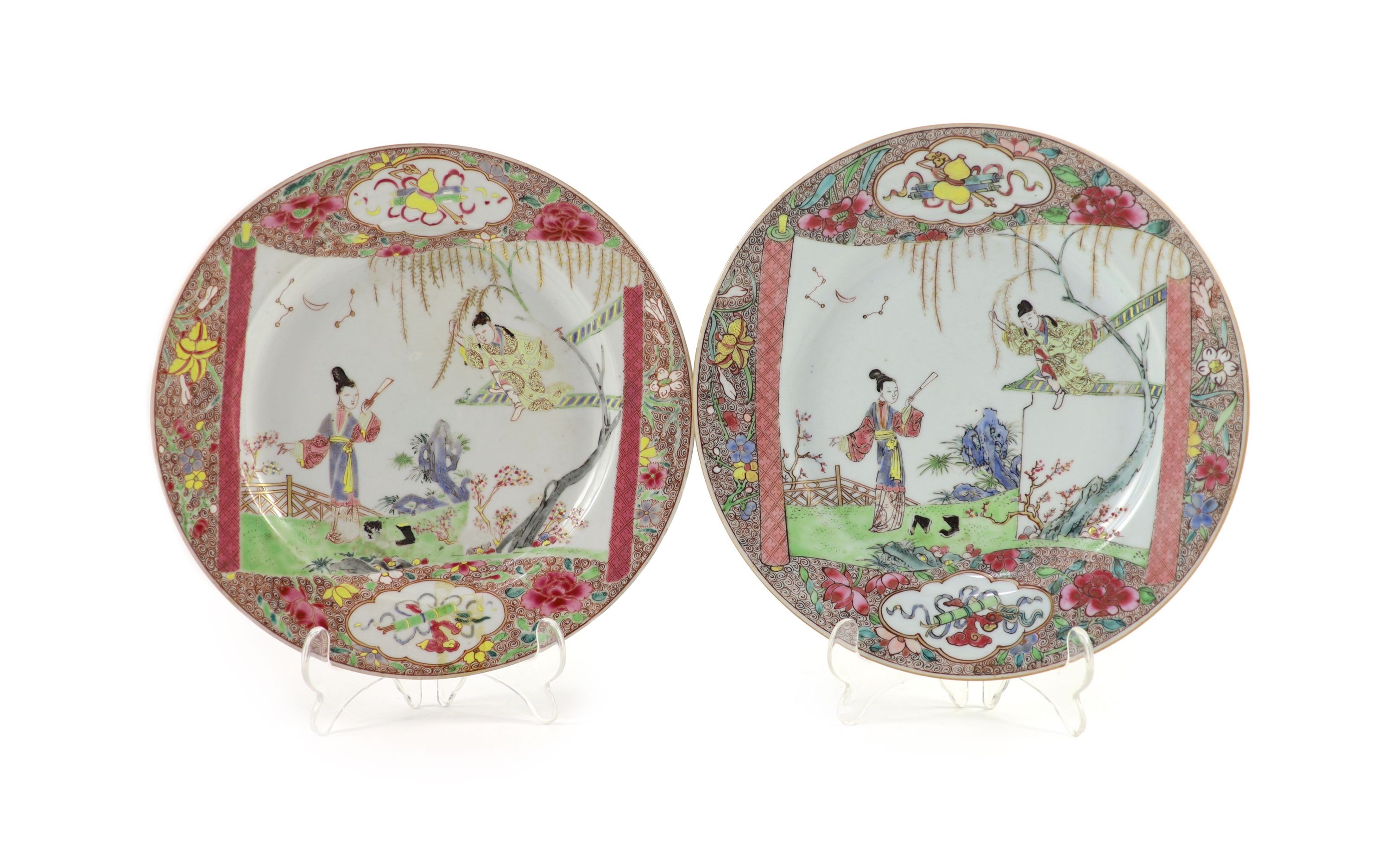 A near pair of Chinese famille rose plates, early Qianlong period, 23.3 and 22.7cm diameter