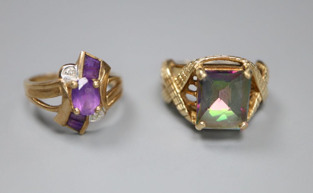 A 9ct gold and tourmaline? dress ring with fancy mount and a 9ct gold, amethyst and diamond crossover ring, gross 10.7g