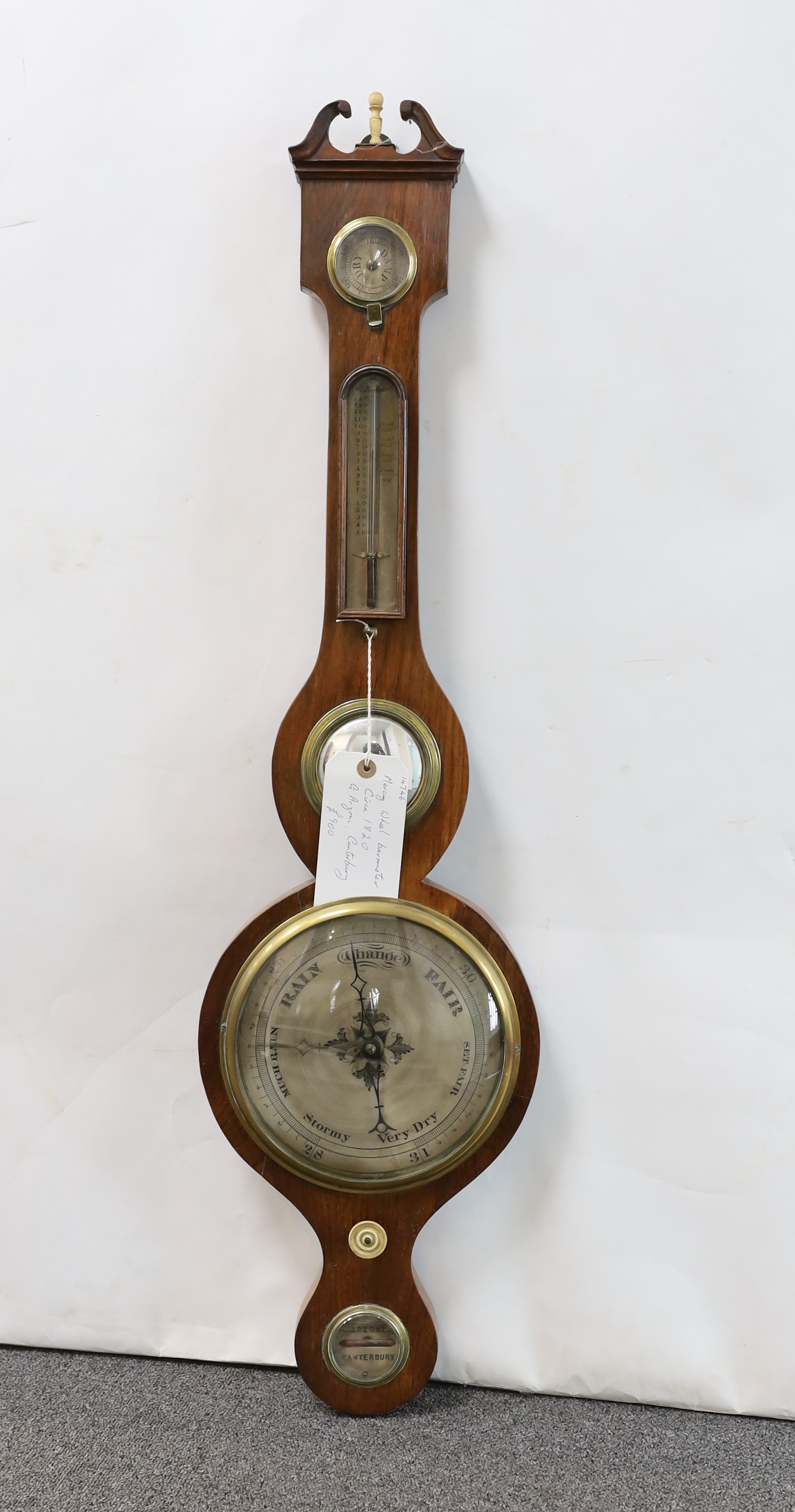 A George III rosewood wheel barometer and thermometer, with engraved silvered dials marked G. Arzoni, Canterbury, height 97cm