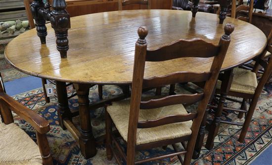 A 17th century style oak double gateleg table W.210cm. A 17th century style oak double gateleg table W.210cm.