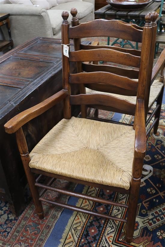 A set of eight ladderback rush seat oak dining chairs A set of eight ladderback rush seat oak dining chairs