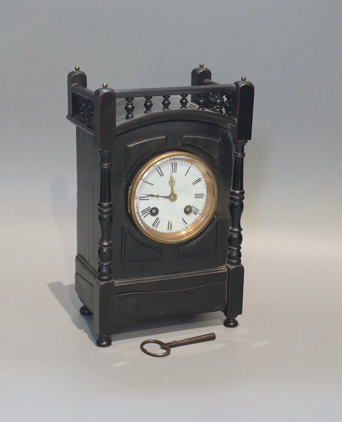 A late Victorian ebonised eight day mantel clock, height 27cm
