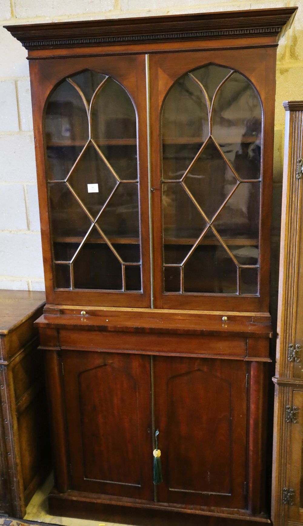 A mahogany bookcase / cupboard, width 90cm depth 36cm height 195cm