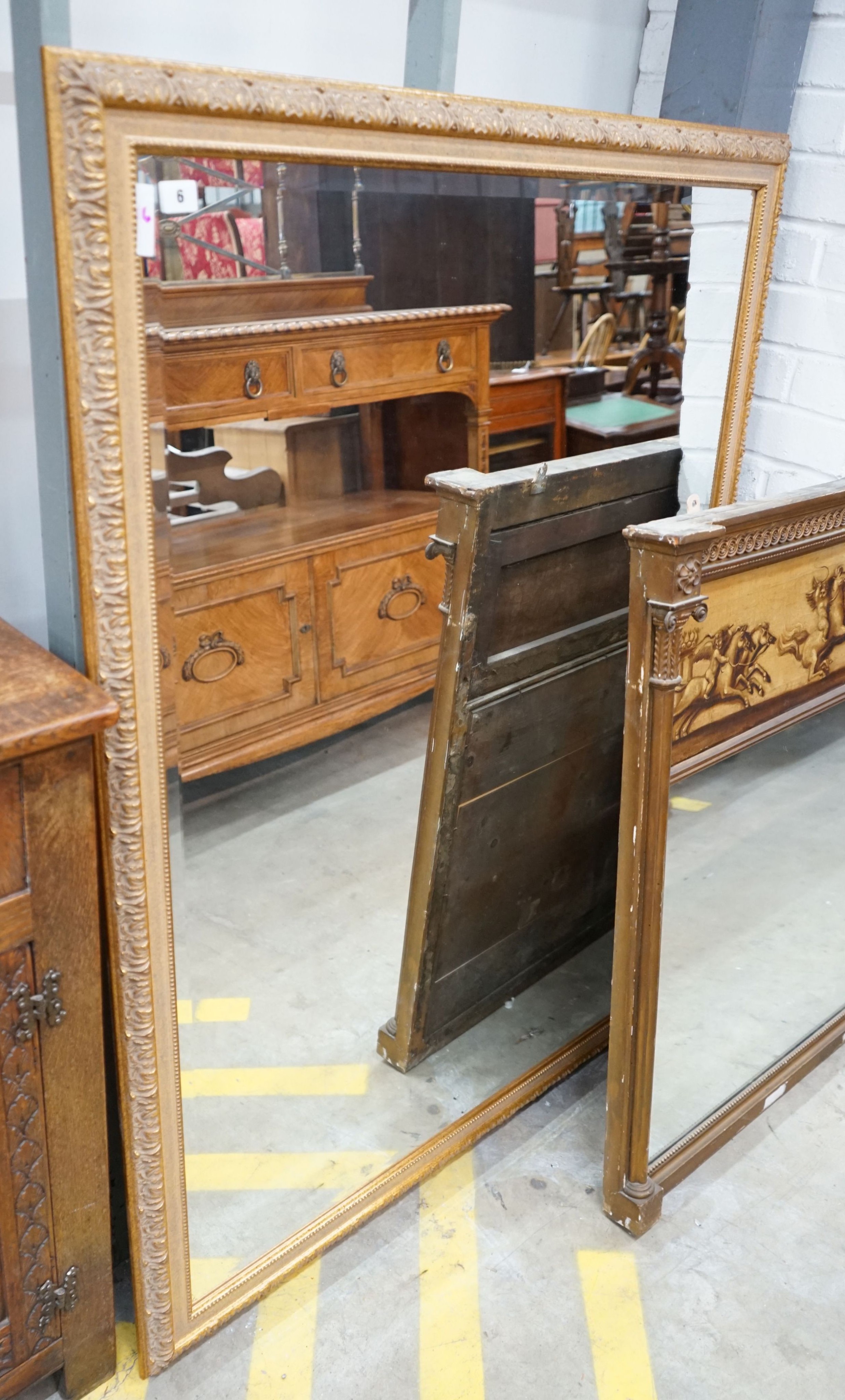 A reproduction gilt framed wall mirror, width 103cm, height 135cm
