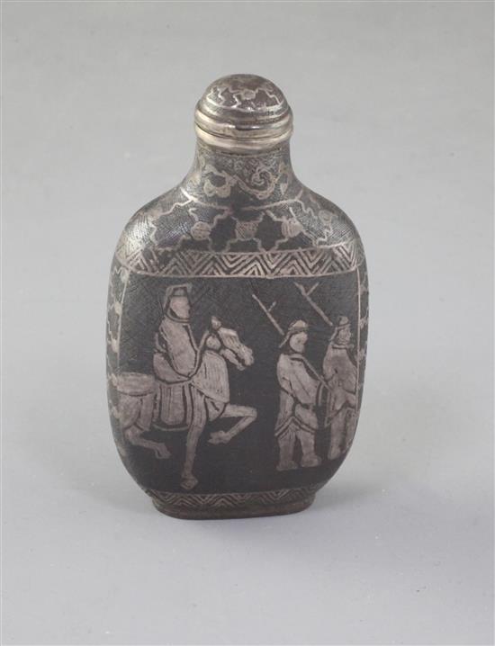 A Chinese iron and silver inlaid snuff bottle, late 19th/early 20th century, 7.3cm including stopper (no. 795) A Chinese iron and silver inlaid snuff bottle, late 19th/early 20th century, 7.3cm including stopper (no. 795)