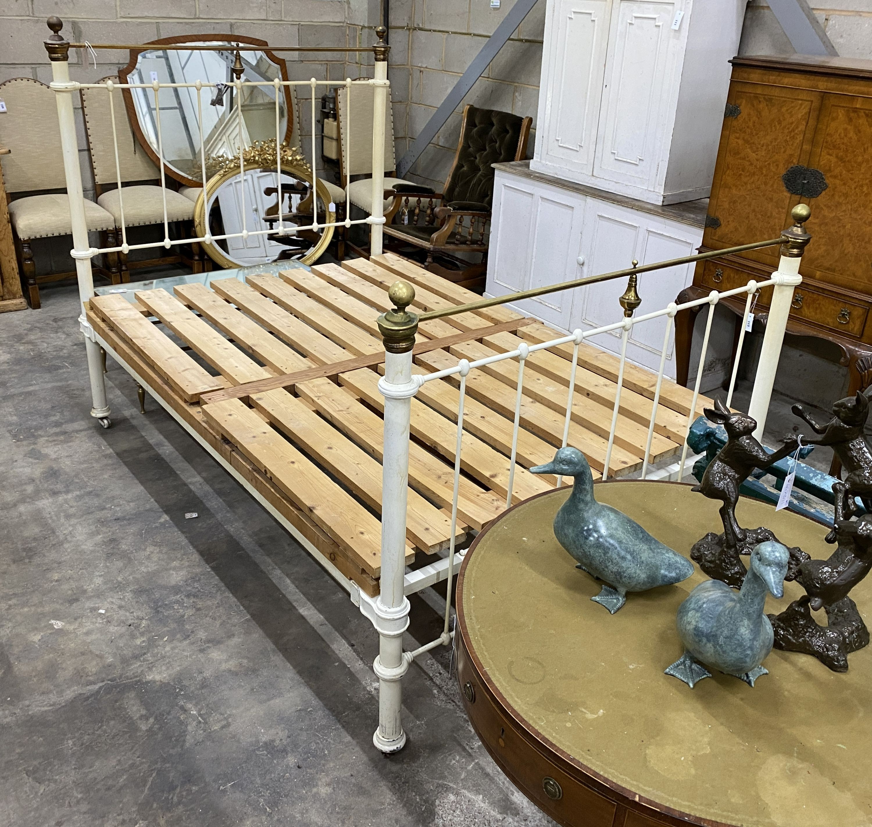 A Victorian style painted iron and brass double bed frame, width 136cm, length 200cm