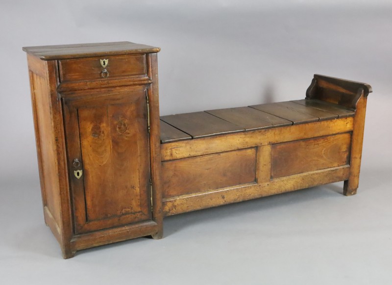 An early 19th century French oak box seat settle, W.6ft 2in. D.1ft 8in. H.3ft 2in. An early 19th century French oak box seat settle, W.6ft 2in. D.1ft 8in. H.3ft 2in.