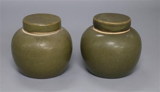 A pair of Chinese teadust glazed small jars and covers, early 20th century, 8cm high A pair of Chinese teadust glazed small jars and covers, early 20th century, 8cm high