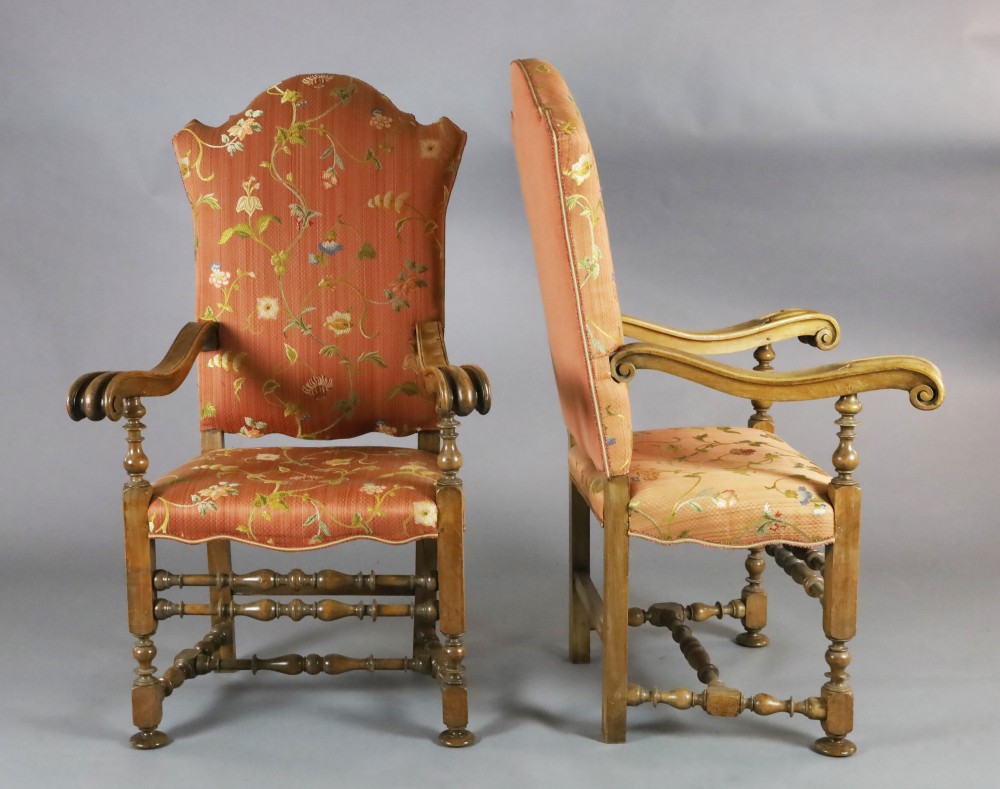 A pair of 19th century French 17th century style carved walnut high back armchairs, W.2ft 7in. H.4ft 3in. A pair of 19th century French 17th century style carved walnut high back armchairs, W.2ft 7in. H.4ft 3in.