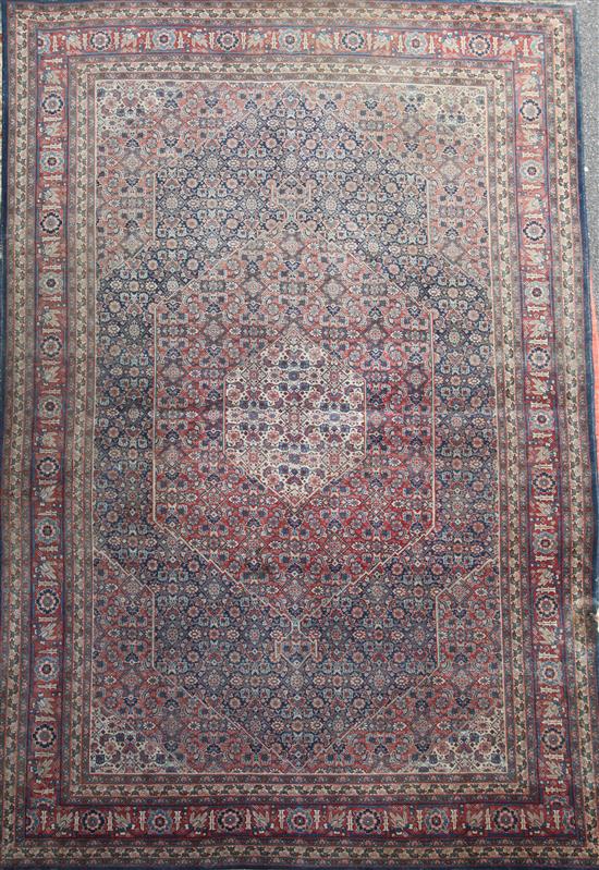 A Caucasian red and blue ground carpet, 11ft 10in by 8ft 4in. A Caucasian red and blue ground carpet, 11ft 10in by 8ft 4in.