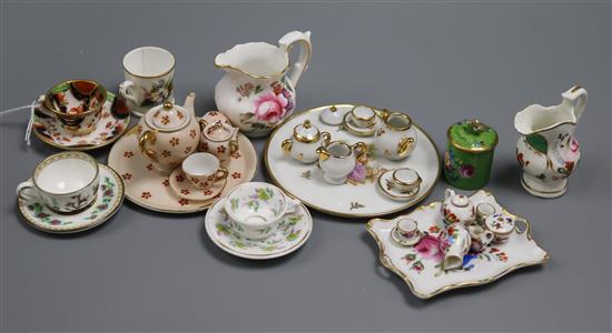 A group of miniature china including teasets, cup and saucers, jugs, etc. A group of miniature china including teasets, cup and saucers, jugs, etc.