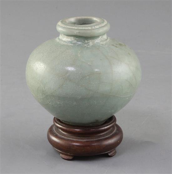 A Chinese Longquan celadon ovoid jar, Song - Yuan dynasty, 7.5cm, wood stand A Chinese Longquan celadon ovoid jar, Song - Yuan dynasty, 7.5cm, wood stand