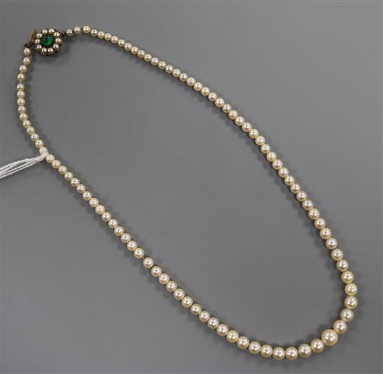 An early 20th century single strand graduated cultured pearl necklace, with green cabochon set clasp, approx 45cm. An early 20th century single strand graduated cultured pearl necklace, with green cabochon set clasp, approx 45cm.