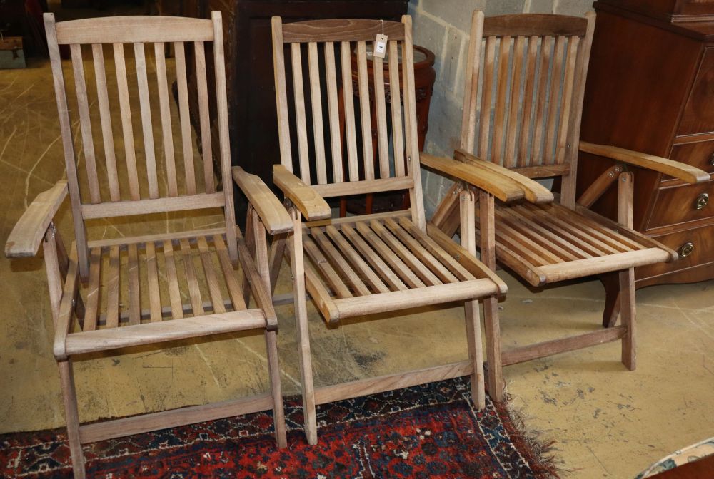 Three teak folding garden armchairs Sale 240820 - Lot 1001 - - Gorringe's
