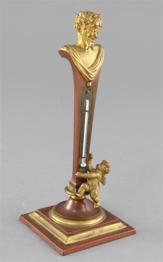 An early 20th century French gilt and patinated bronze desk thermometer, height 8in. An early 20th century French gilt and patinated bronze desk thermometer, height 8in.