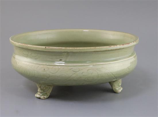 A Chinese Ming Longquan celadon tripod censer, 16th century, D. 27cm, hairline cracks A Chinese Ming Longquan celadon tripod censer, 16th century, D. 27cm, hairline cracks