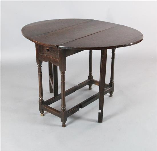 A late 17th century oak gateleg table, W.2ft 9in. H.2ft 4in. A late 17th century oak gateleg table, W.2ft 9in. H.2ft 4in.