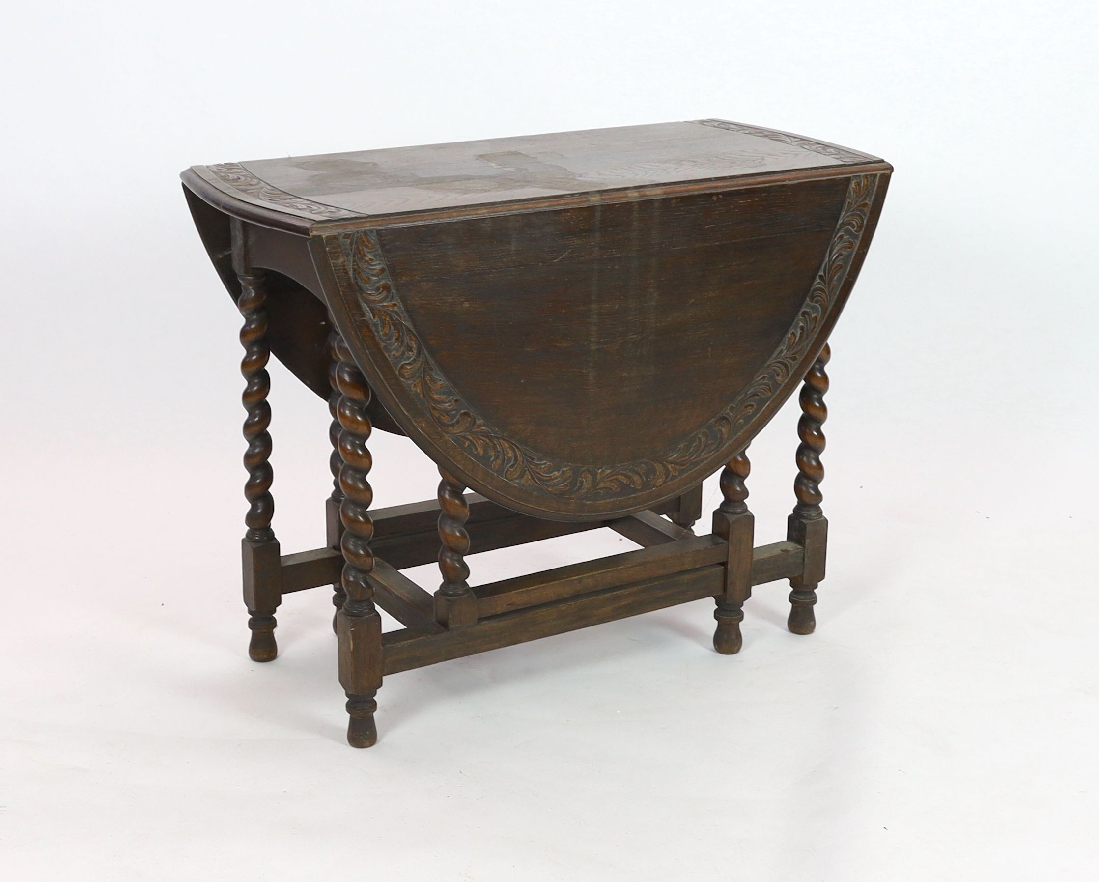 An early 20th century 18th century style oak gateleg dining table, width 98cm depth 46cm height 76cm