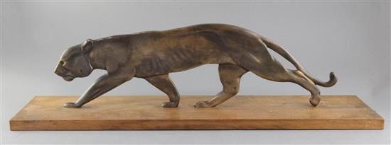 A French Art Deco bronze model of a prowling panther, width 27.5in. A French Art Deco bronze model of a prowling panther, width 27.5in.