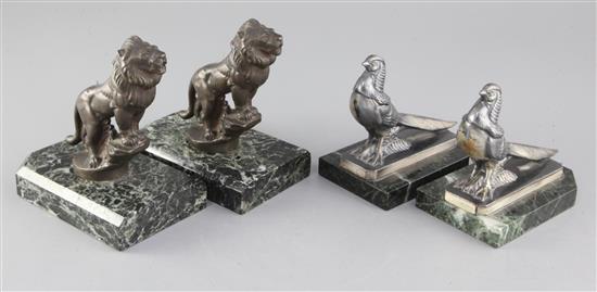 Maurice Frécourt. Two pairs of Art Deco bronzed and silvered metal bookends, roaring lions and Asian pheasants, 5.75in. and 5.5in. Maurice Frécourt. Two pairs of Art Deco bronzed and silvered metal bookends, roaring lions and Asian pheasants, 5.75in. and 5.5in.