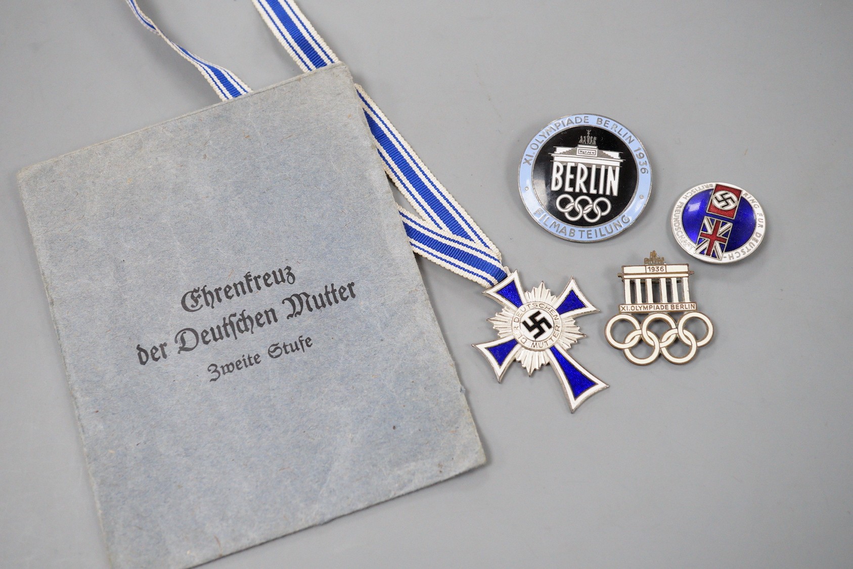Two German XI Olympiade Berlin 1936 enamel badges, by Rob. Neff and Paulmann & Crone, a Third Reich 