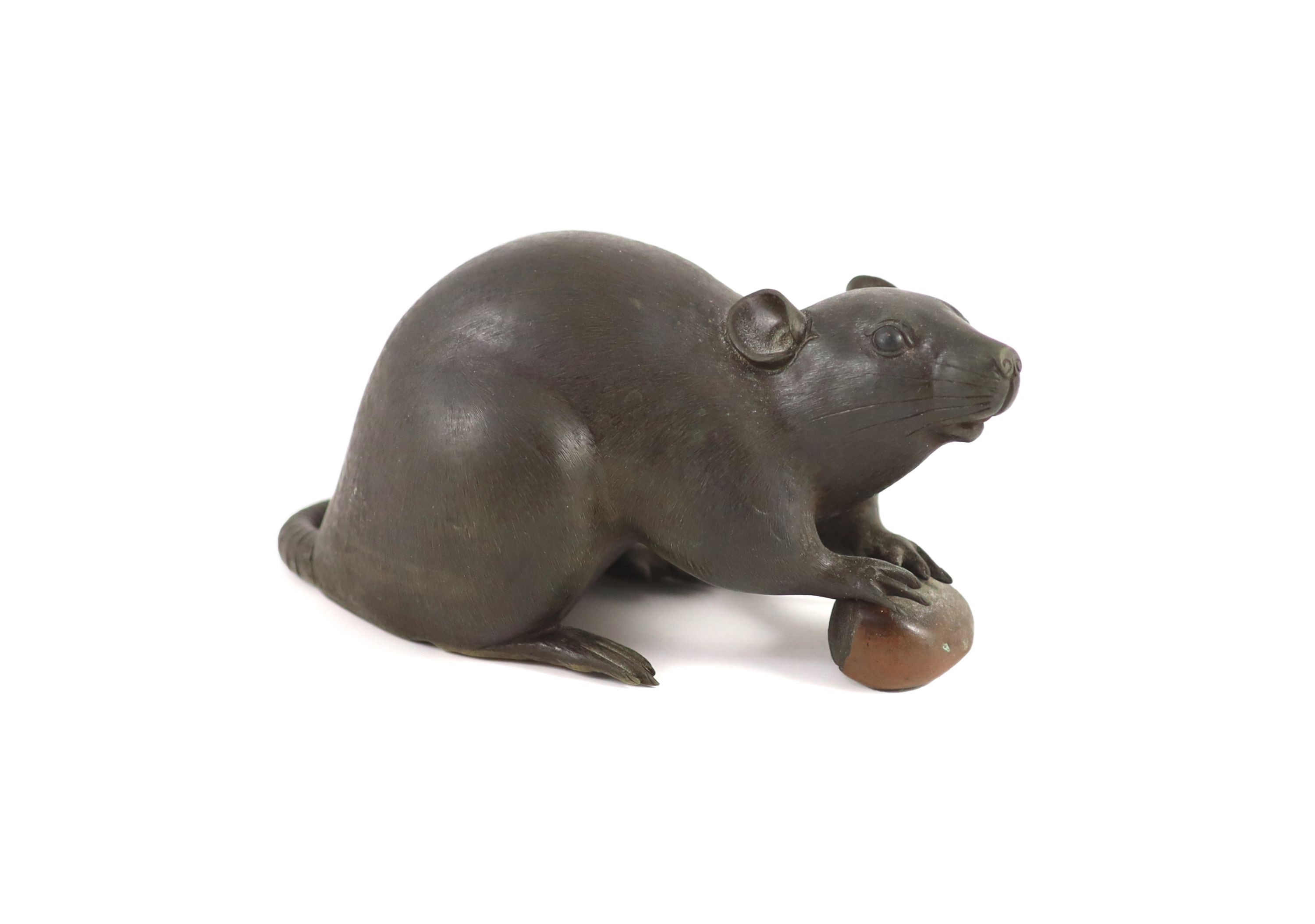 A Japanese two colour bronze figure of a rat, Meiji period, signed Seishu, 18cm long
