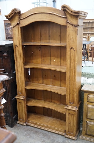 An 18th century style French provincial pine open bookcase, length 116cm, depth 28cm, height 204cm