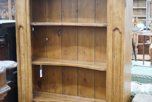 An 18th century style French provincial pine open bookcase, length 116cm, depth 28cm, height 204cm
