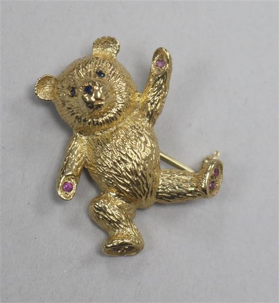 A 9ct gold and gem set teddy bear brooch, 31mm. A 9ct gold and gem set teddy bear brooch, 31mm.