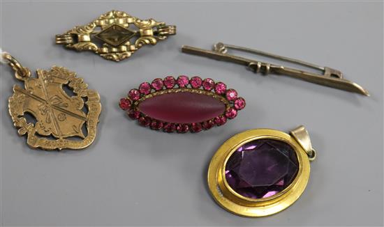 A late Victorian H.U. Championship 9ct gold medal and four items of costume jewellery. A late Victorian H.U. Championship 9ct gold medal and four items of costume jewellery.