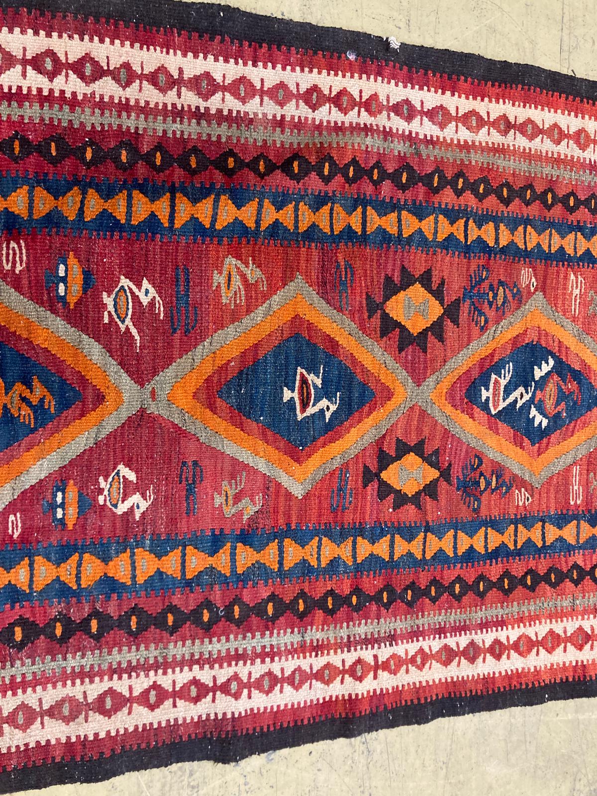 A polychrome Kelim rug, 270 x 134cm.