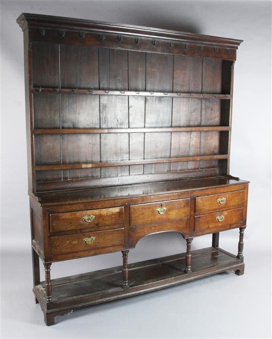 A George III oak dresser, W.6ft 3in. D.1ft 3in. H.6ft 10in. A George III oak dresser, W.6ft 3in. D.1ft 3in. H.6ft 10in.