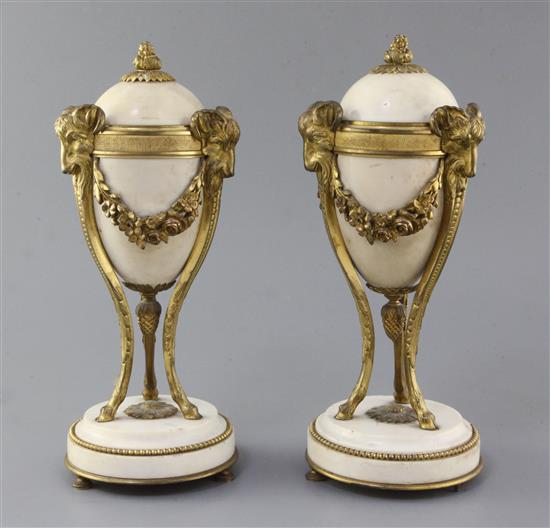 A pair of ormolu mounted white marble cassolets, height 11in. A pair of ormolu mounted white marble cassolets, height 11in.