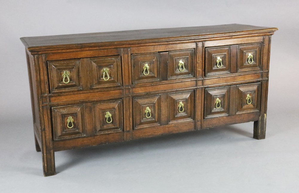 A 17th century style oak dresser base, W.5ft 8in. D.1ft 9in. H.2ft 9in. A 17th century style oak dresser base, W.5ft 8in. D.1ft 9in. H.2ft 9in.