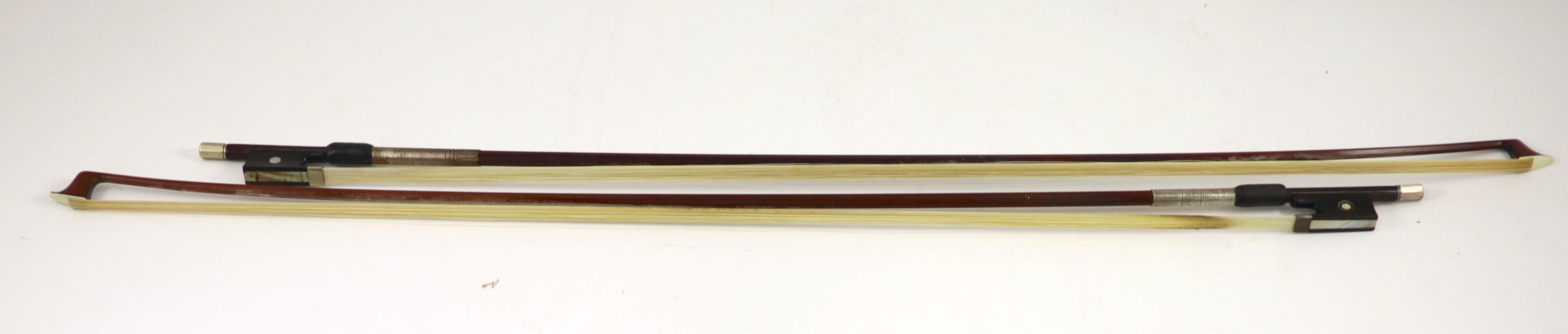 Two stamped violin bows, Both 74.5 cm long