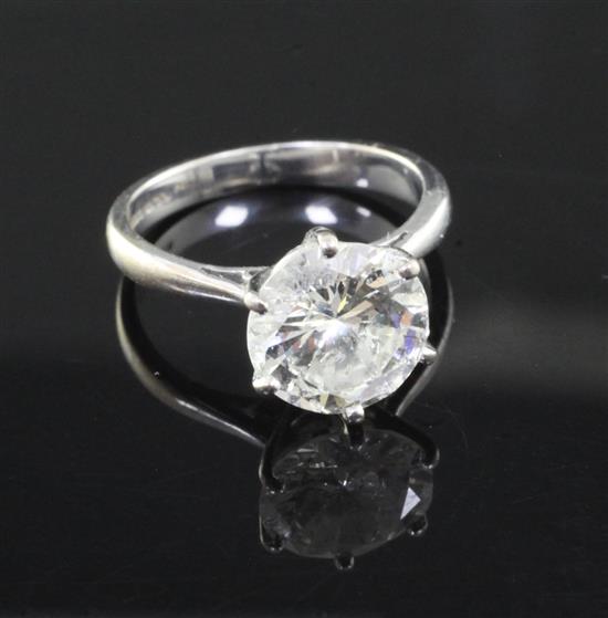 An 18ct white gold and solitaire diamond ring, size J/K. An 18ct white gold and solitaire diamond ring, size J/K.