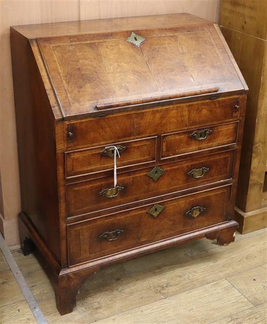 An early 18th century herringbone crossbanded walnut bureau (a.f.) W.76cm An early 18th century herringbone crossbanded walnut bureau (a.f.) W.76cm
